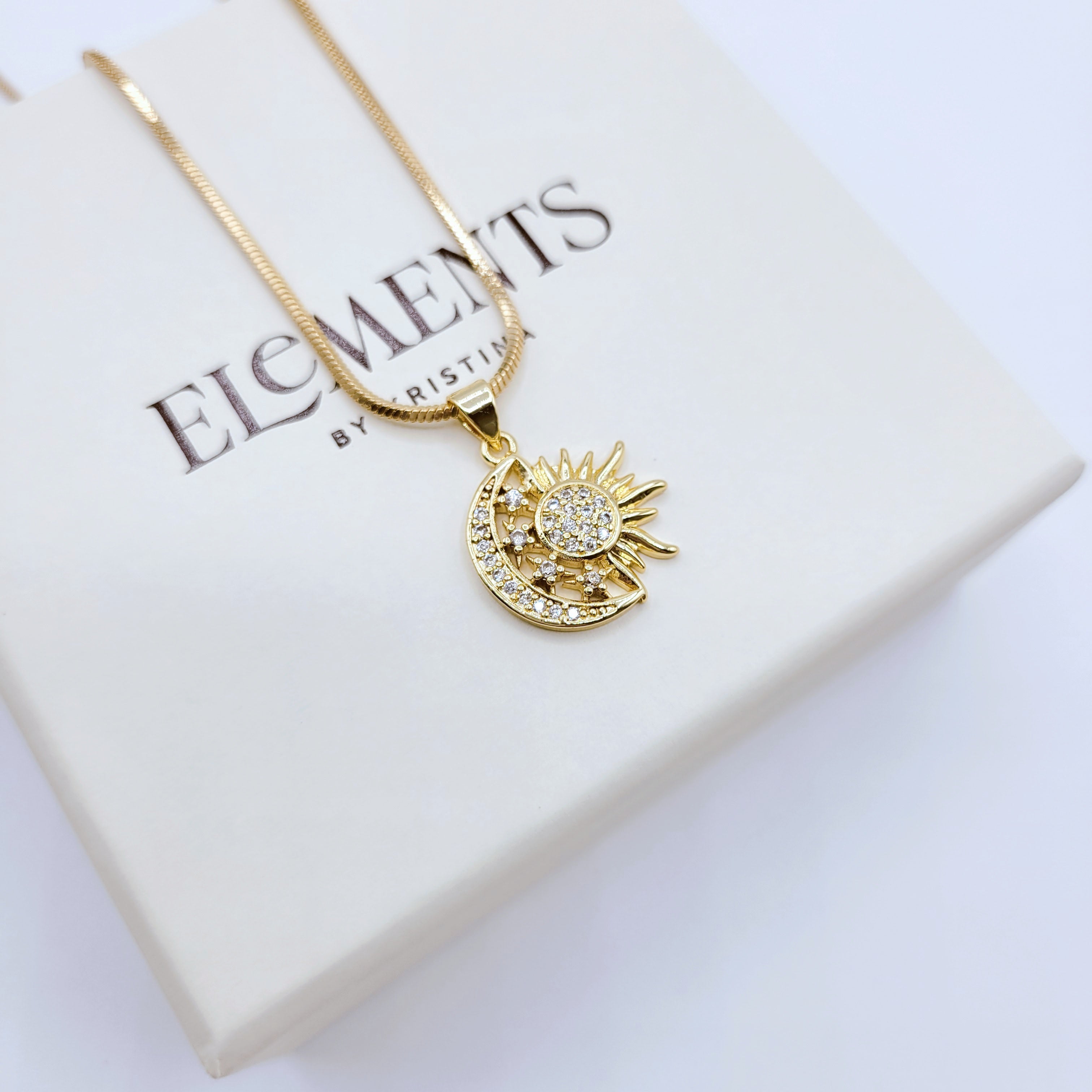 Sun and moon necklace in gold